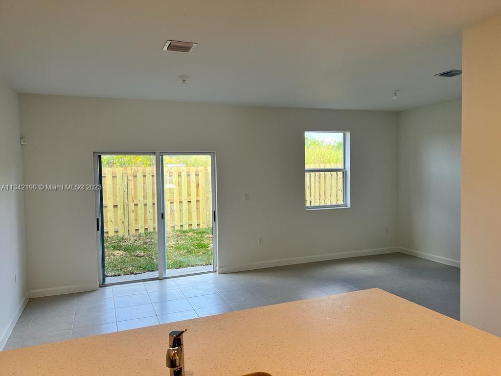 2633 Southeast 10th Street, Unit 2633 Homestead, FL 33035 - Photo 6 of 42 a view of room with window