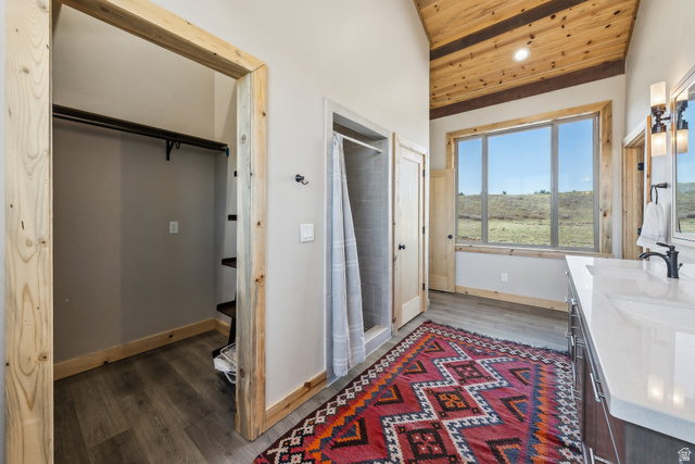 46997 West Thunder Road Fruitland, UT 84027 - Photo 33 of 49 Bathroom with wooden ceiling, double vanity, dark wood-type flooring, a shower stall, and lofted ceiling