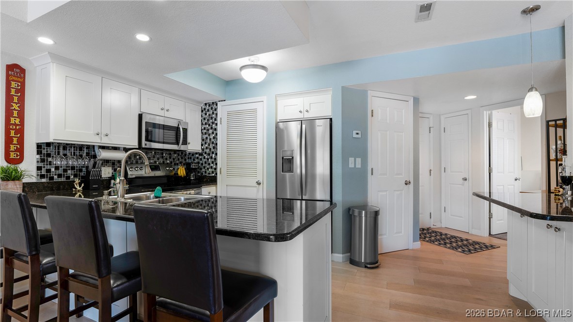 40 Lighthouse Road, Unit 5201 Lake Ozark, MO 65049 - Photo 5 of 32 Updated kitchen with pantry and added bar/entertai