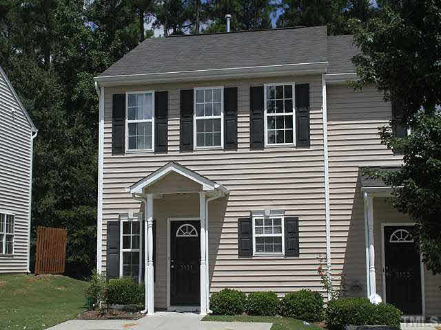 End unit townhome backs up to a wooded buffer for optimal privacy.