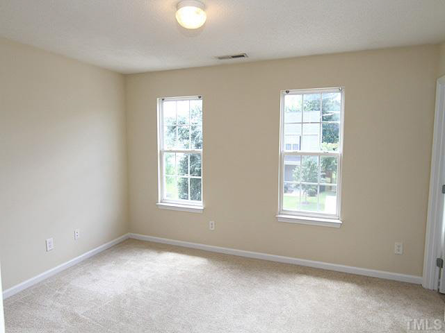 3131 Manhasset Lane Raleigh, NC 27604 - Photo 16 of 21 The second bedroom has its own bath and sizeable walk in closet.