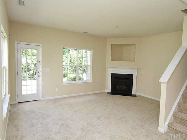 3131 Manhasset Lane Raleigh, NC 27604 - Photo 3 of 21 Just repainted and new carpet and pad installed. Features a gas fireplace and lots of windows for natural light in the19x13 living area (9 foot ceilings).