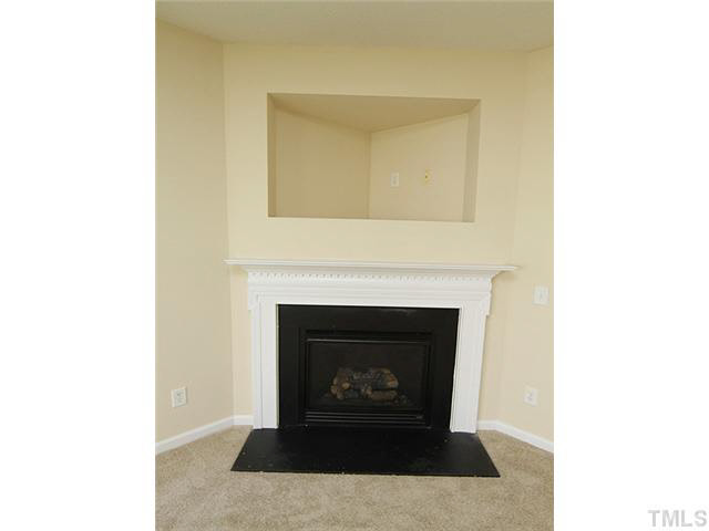 3131 Manhasset Lane Raleigh, NC 27604 - Photo 4 of 21 Gas corner fireplace with entertainment storage nook.