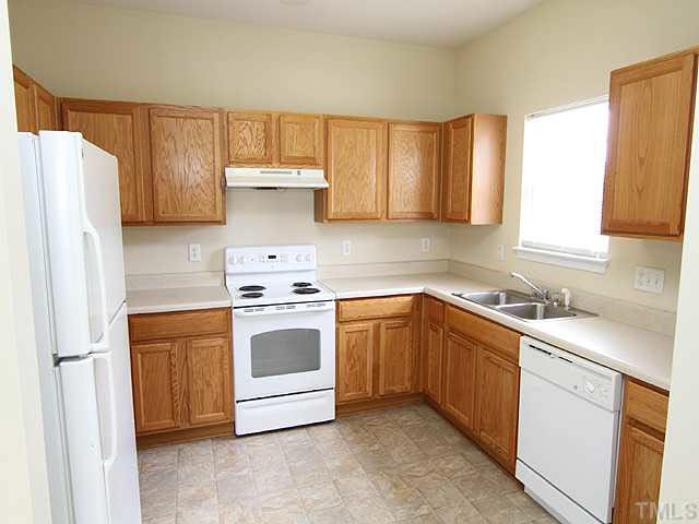 3131 Manhasset Lane Raleigh, NC 27604 - Photo 8 of 21 The kitchen has a new vinyl floor. White appliances, double stainless steel sink and ample cabinet/counter space throughout.