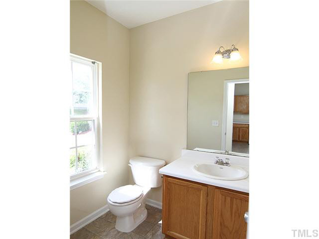 3131 Manhasset Lane Raleigh, NC 27604 - Photo 10 of 21 The half bath also features a new vinyl floor and is located next to the front door.