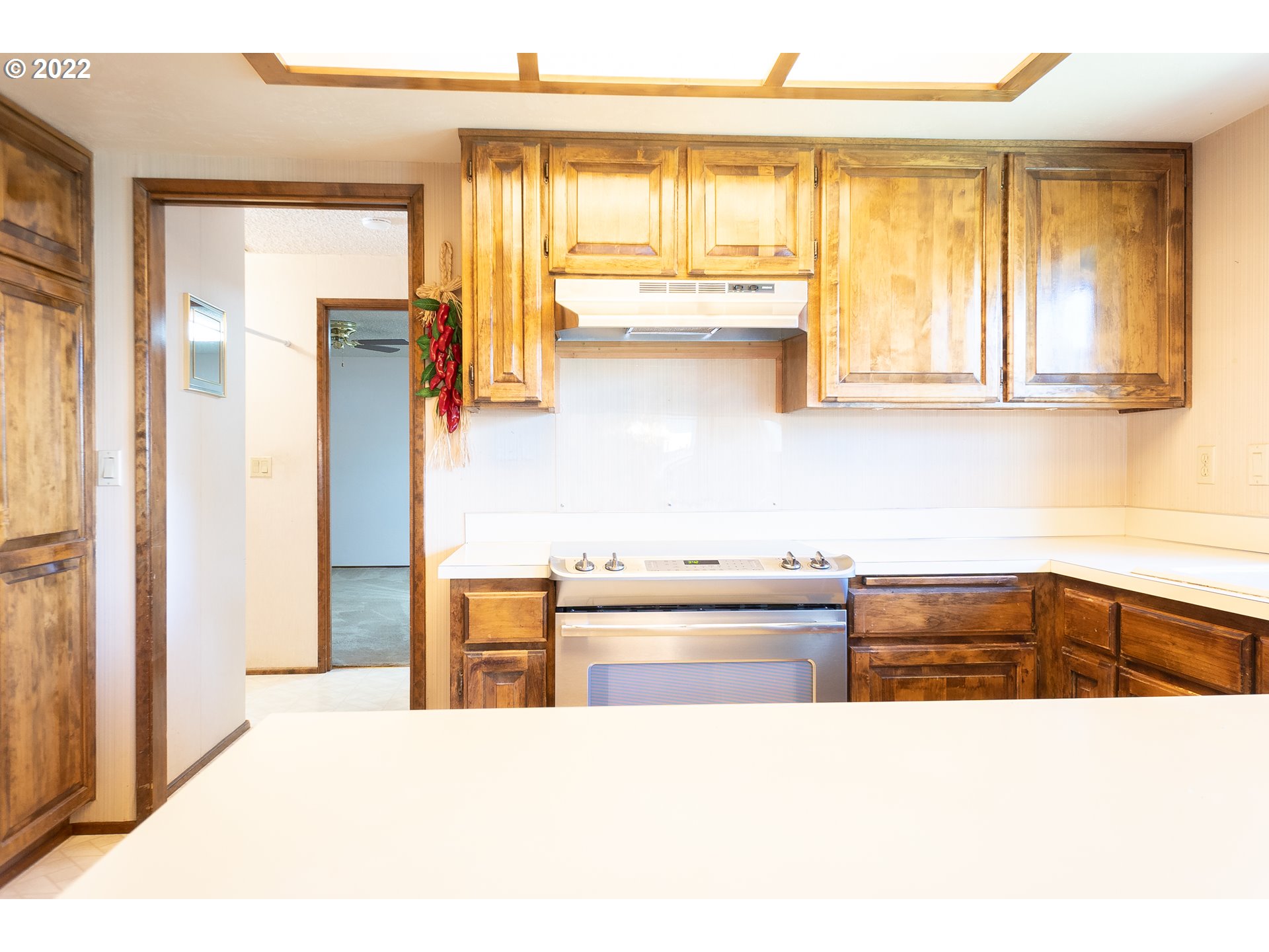 375 72nd Place Springfield, OR 97478 - Photo 13 of 32 a kitchen with stainless steel appliances kitchen island sink stove and cabinets