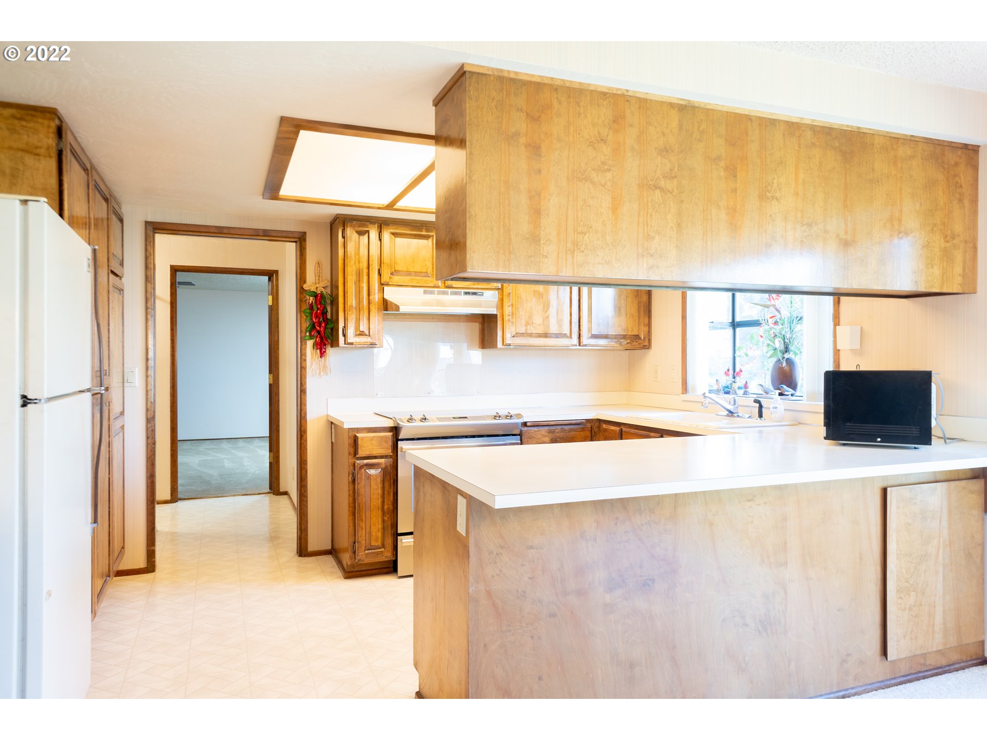 375 72nd Place Springfield, OR 97478 - Photo 14 of 32 a kitchen with stainless steel appliances granite countertop a sink and a refrigerator