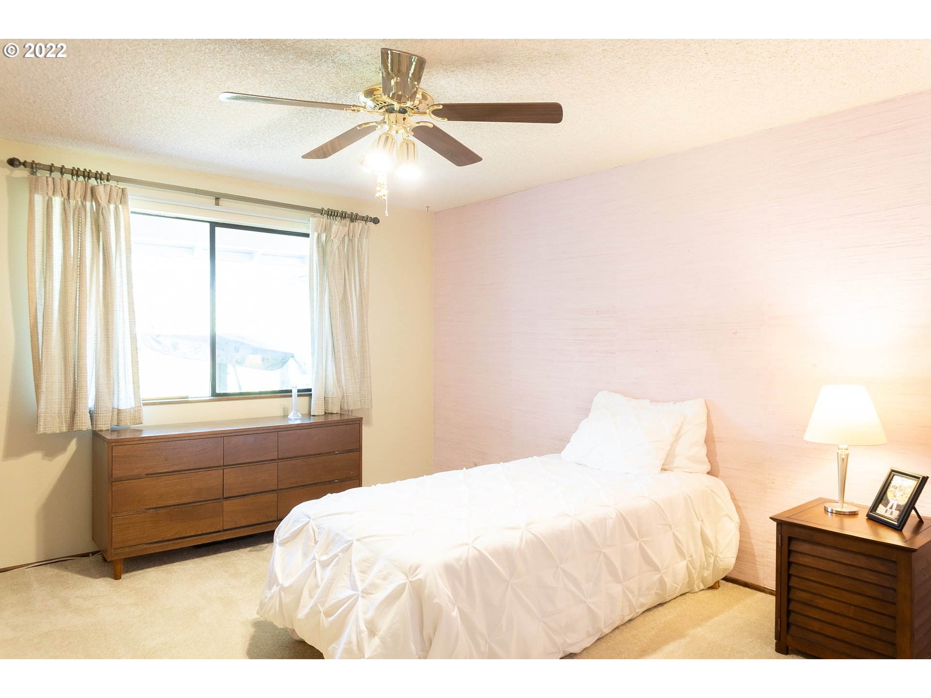 375 72nd Place Springfield, OR 97478 - Photo 18 of 32 a bedroom with a bed and a chandelier