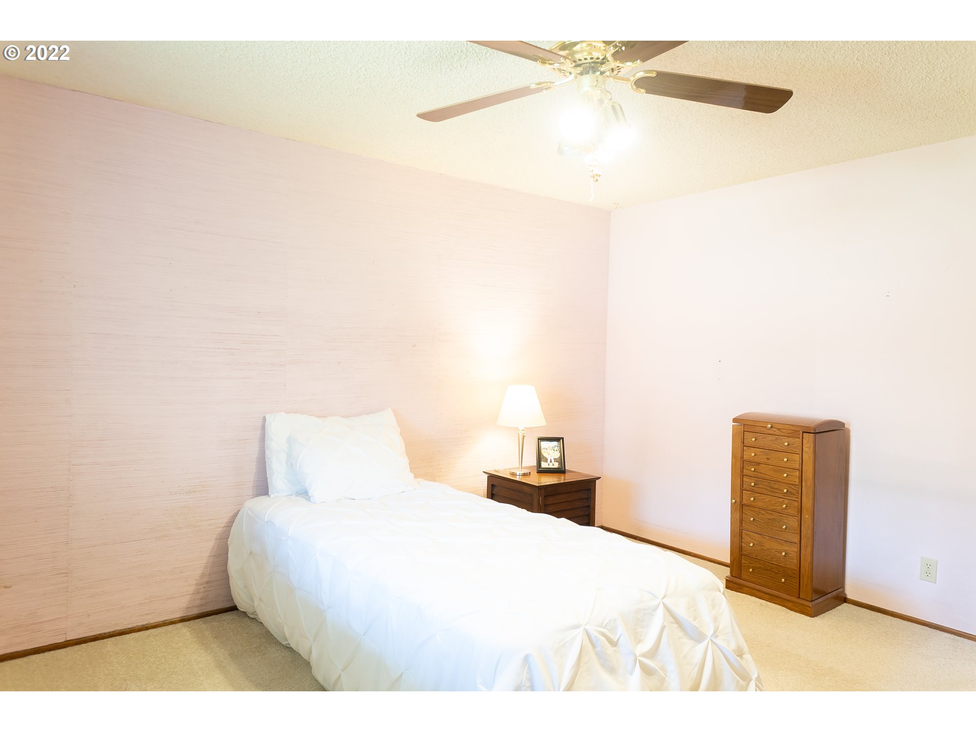 375 72nd Place Springfield, OR 97478 - Photo 19 of 32 a bedroom with a bed and a cabinets