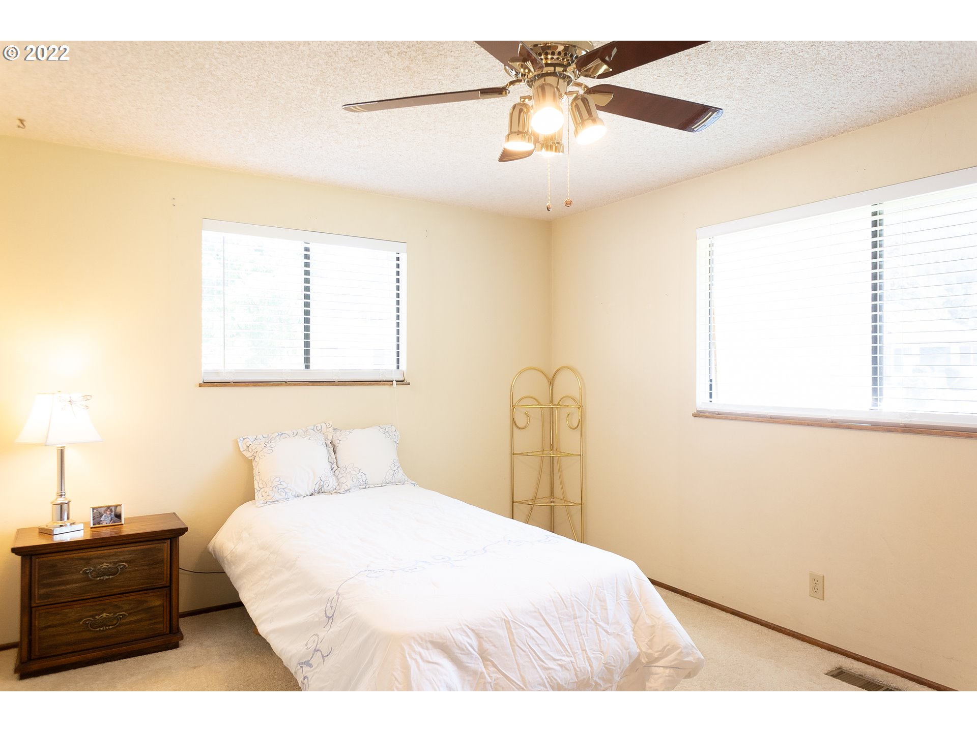 375 72nd Place Springfield, OR 97478 - Photo 20 of 32 a bedroom with a bed and a chandelier