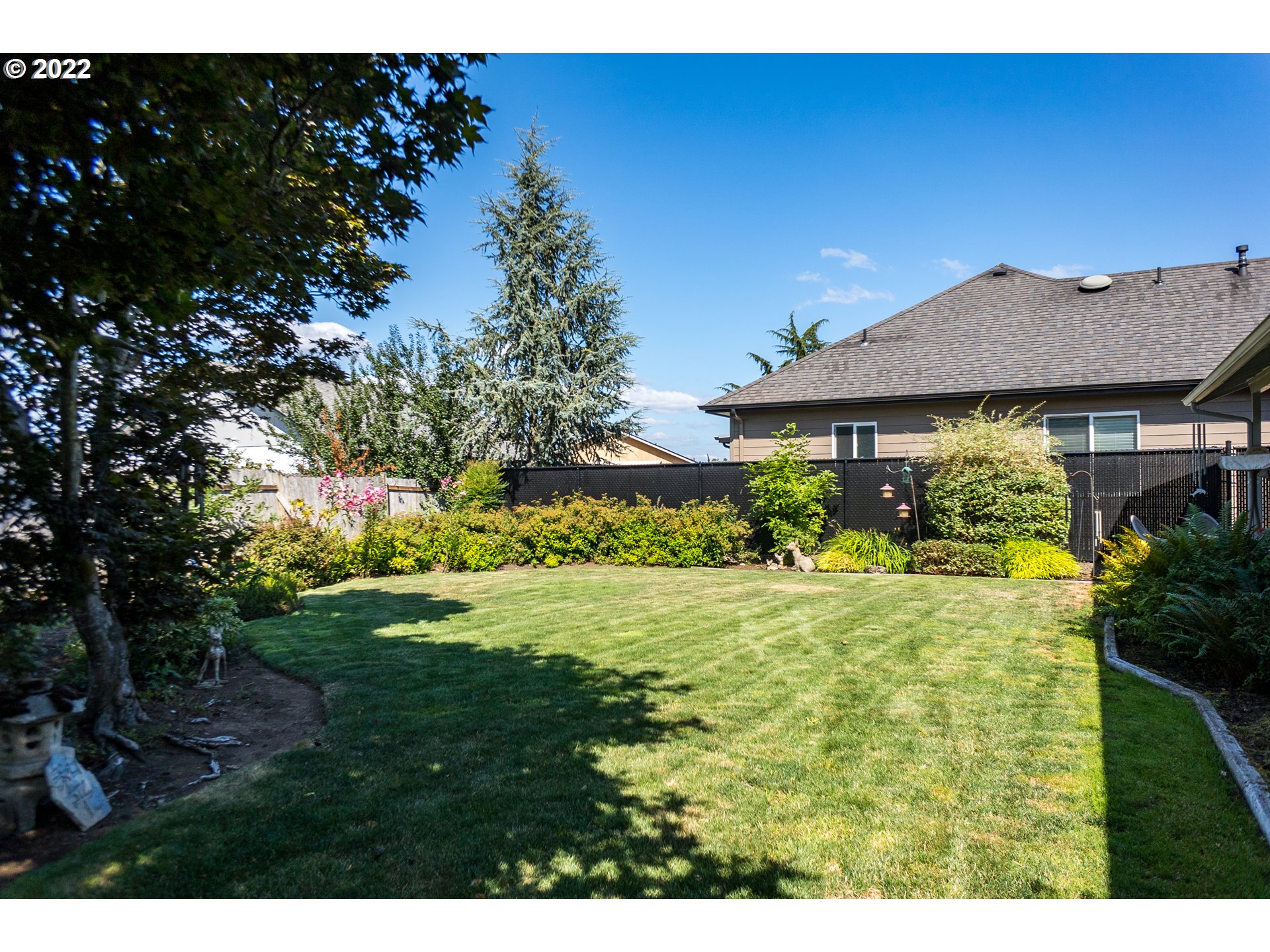 375 72nd Place Springfield, OR 97478 - Photo 31 of 32 a view of a house with garden and a yard