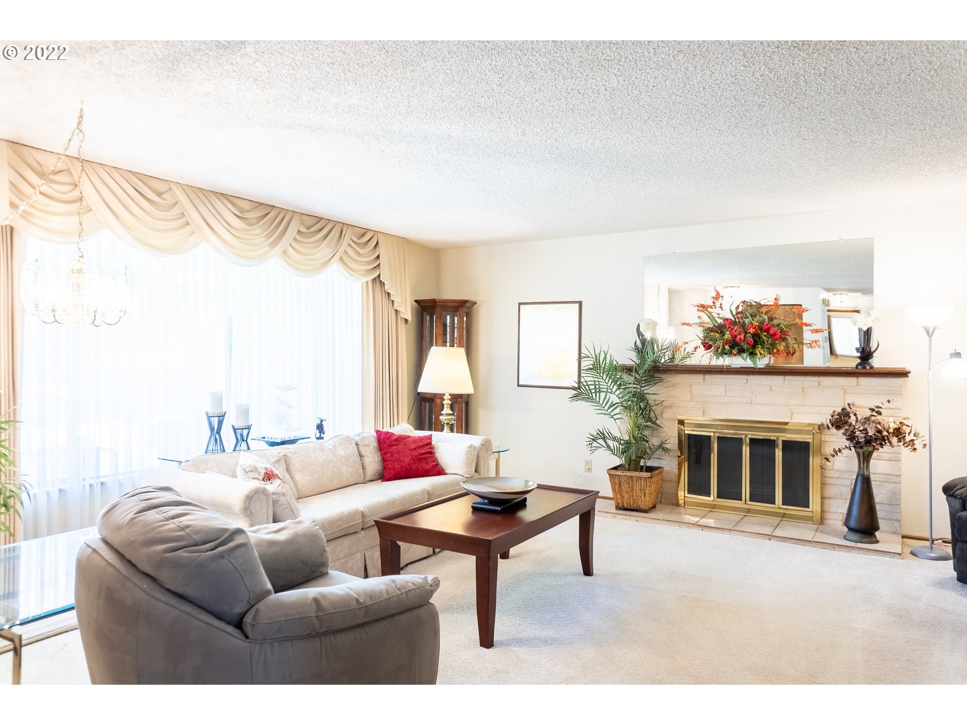 375 72nd Place Springfield, OR 97478 - Photo 6 of 32 a living room with furniture a fireplace and a large window