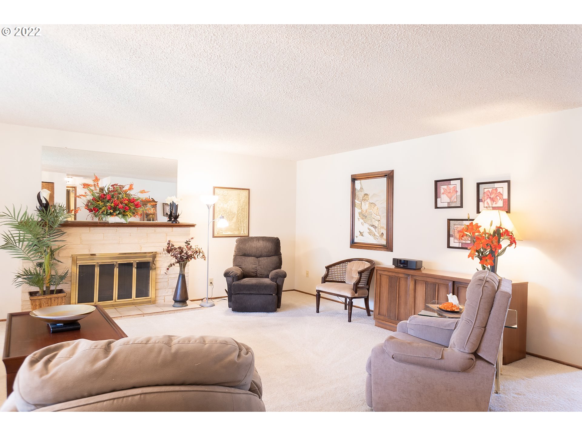 375 72nd Place Springfield, OR 97478 - Photo 9 of 32 a living room with furniture a fireplace and a flat screen tv