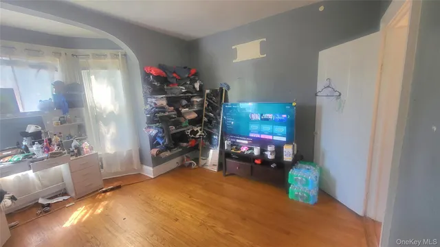 a car parked in front of a house with a yard