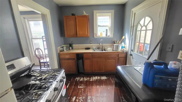 a room with wooden floor and furniture