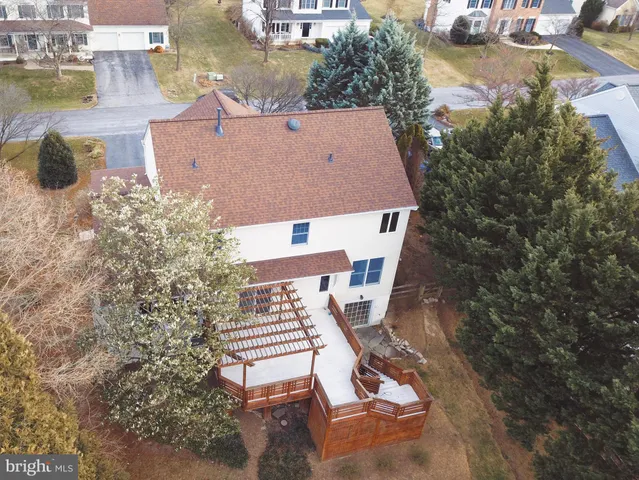 an aerial view of a house with outdoor space