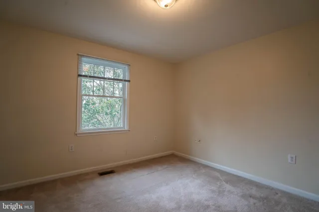 an empty room with closet area