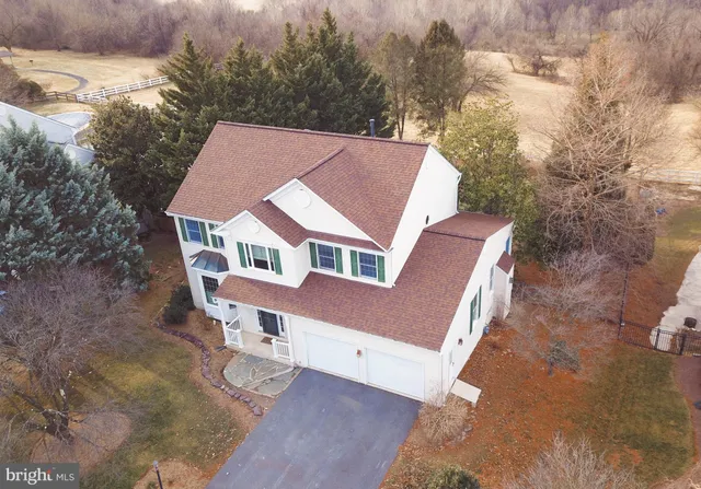 a aerial view of a house with a yard