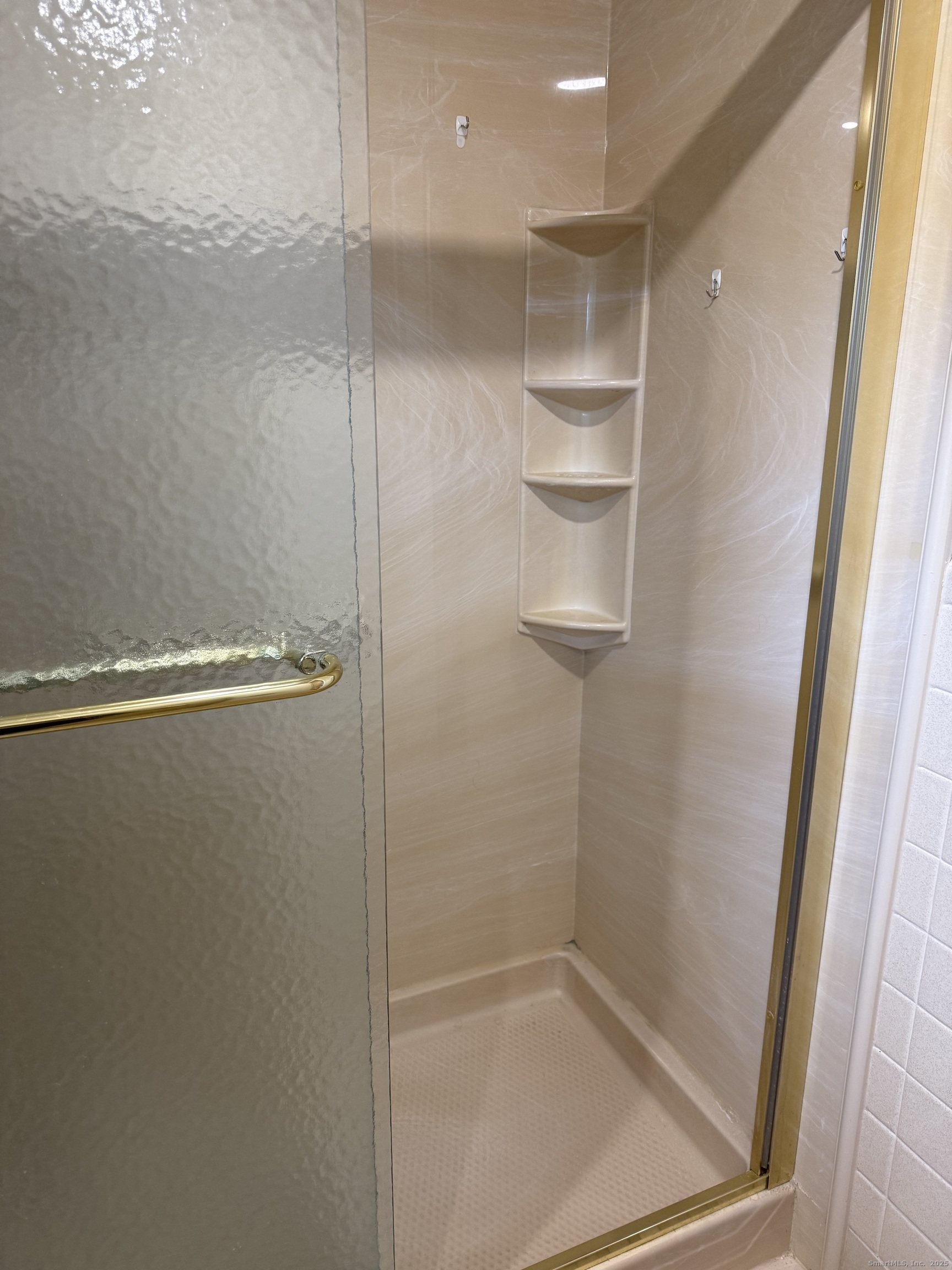 240 Centerbrook Road, Unit 240 Hamden, CT 06518 - Photo 15 of 26 a bathroom with a glass shower door