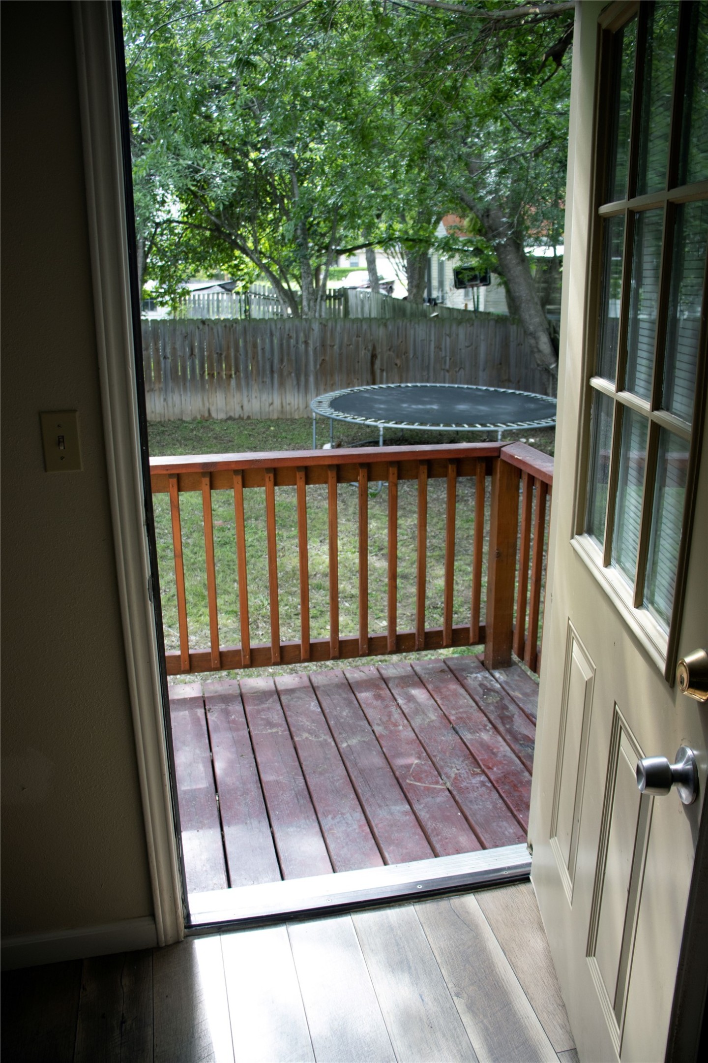 633 South Commerce Street Lockhart, TX 78644 - Photo 21 of 29 Outdoor deck featuring wood plank flooring and a wood railing