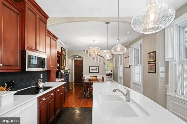a utility room with sink dryer and washer