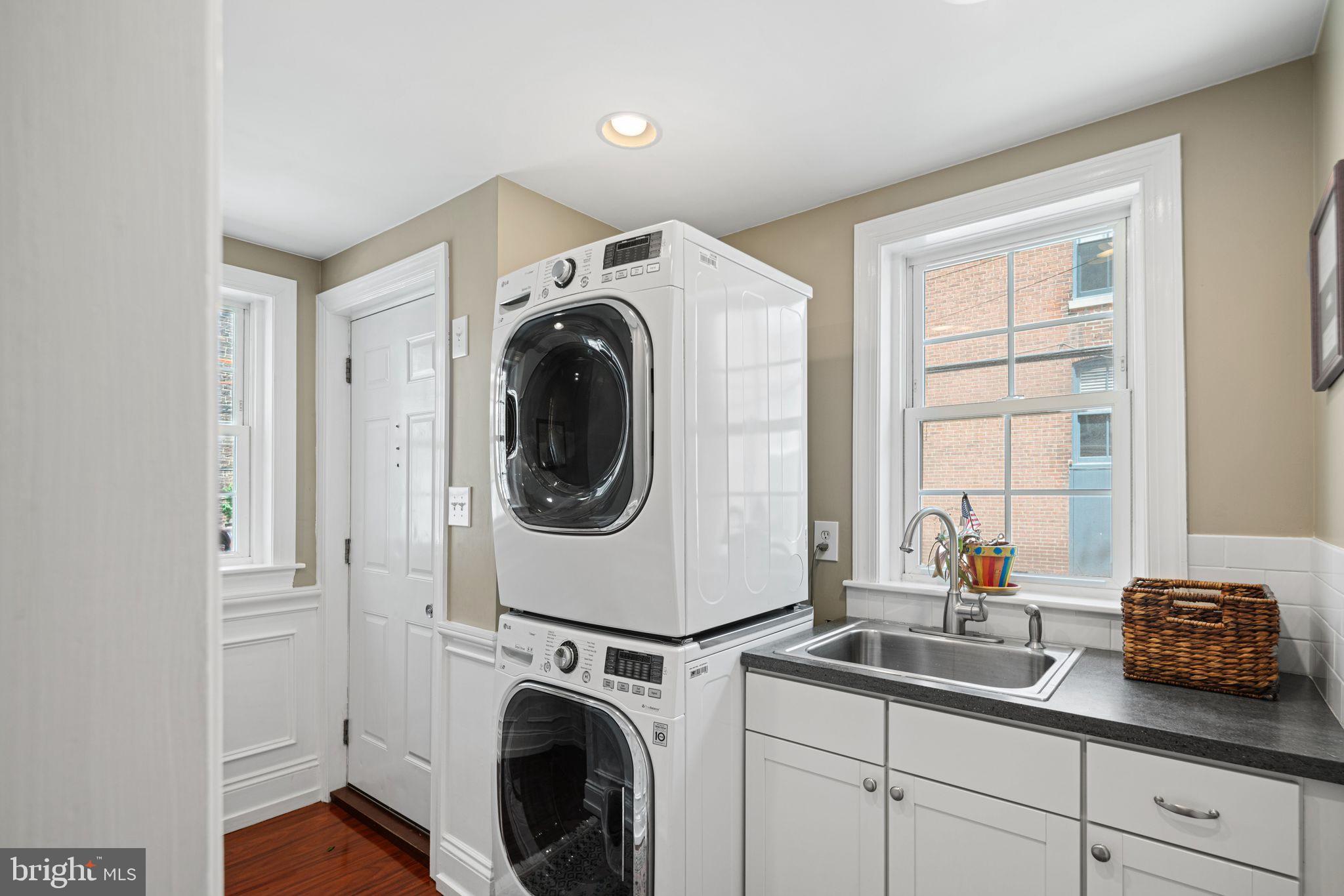 1935 Spring Garden Street Philadelphia, PA 19130 - Photo 15 of 49 a utility room with sink dryer and washer