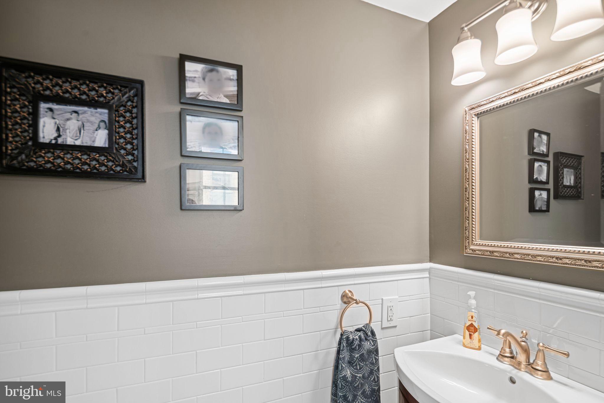 1935 Spring Garden Street Philadelphia, PA 19130 - Photo 16 of 49 a bathroom with a sink and a mirror