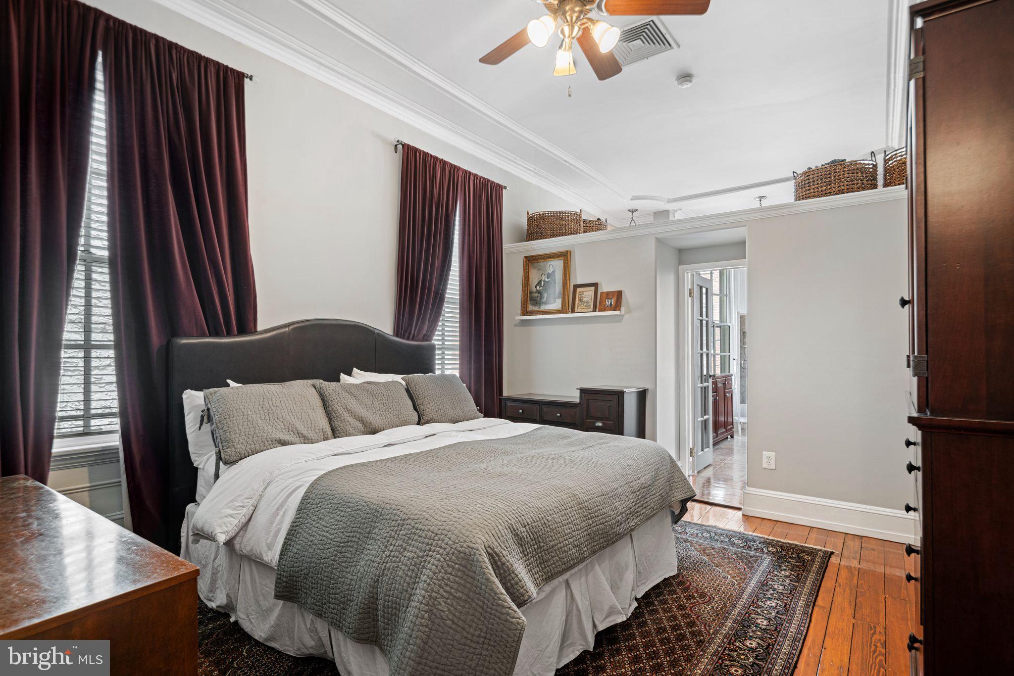 1935 Spring Garden Street Philadelphia, PA 19130 - Photo 18 of 49 a bedroom with bed and a chandelier