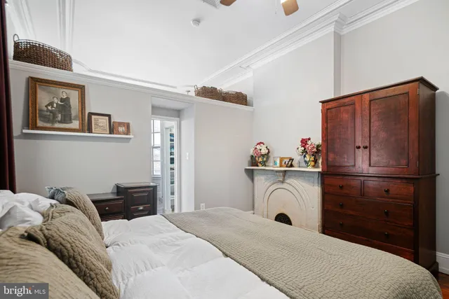 a bathroom with double vanity and a tub