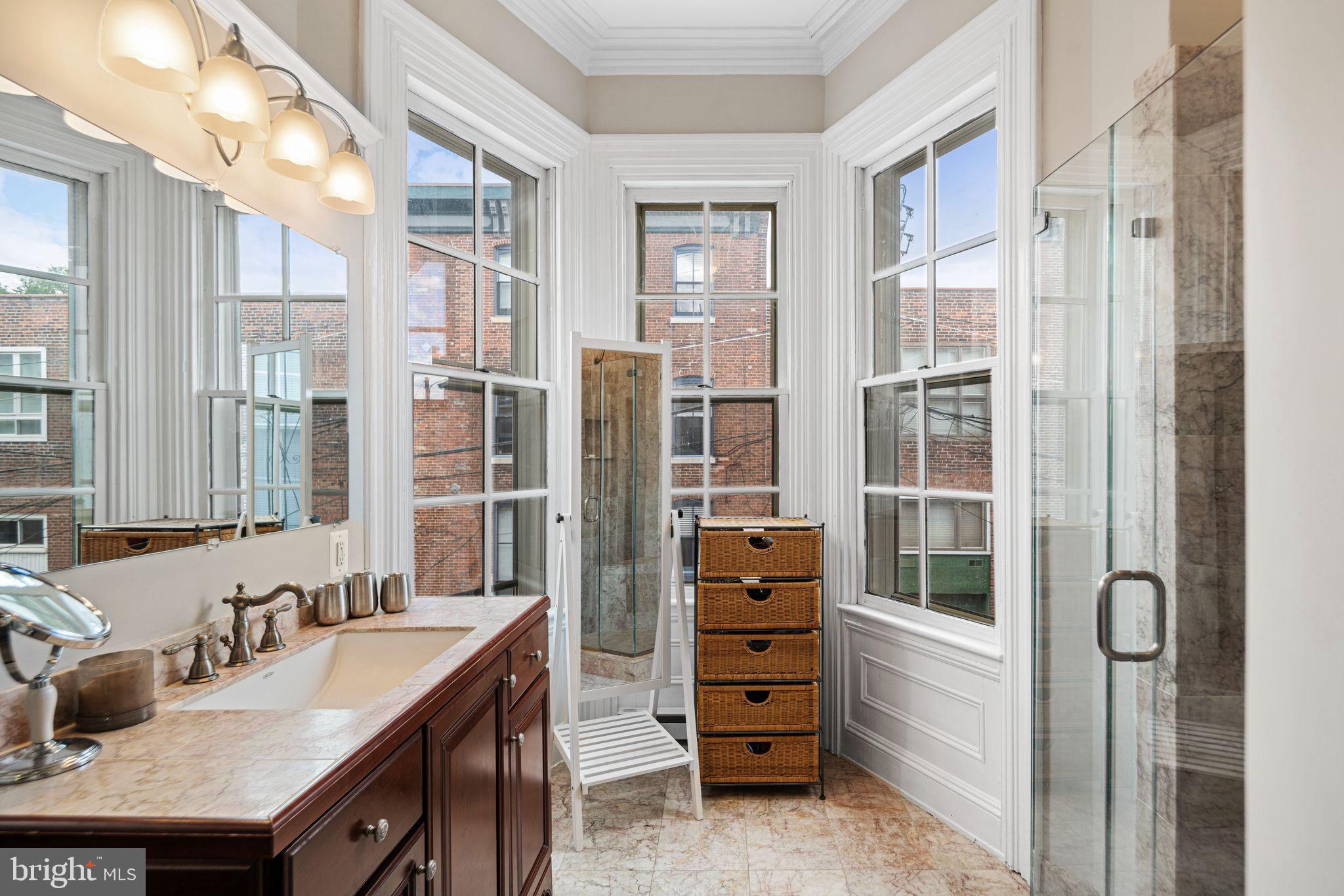 1935 Spring Garden Street Philadelphia, PA 19130 - Photo 20 of 49 a bathroom with double vanity and a tub