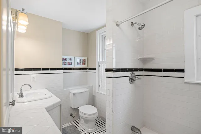 a bedroom with a bed and furniture