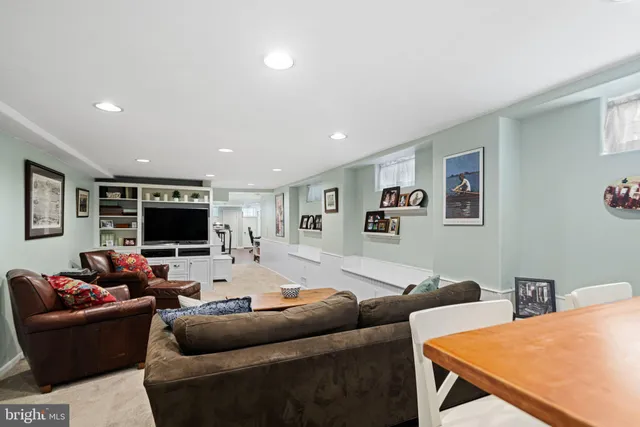 a view of a workspace with furniture and wooden floor