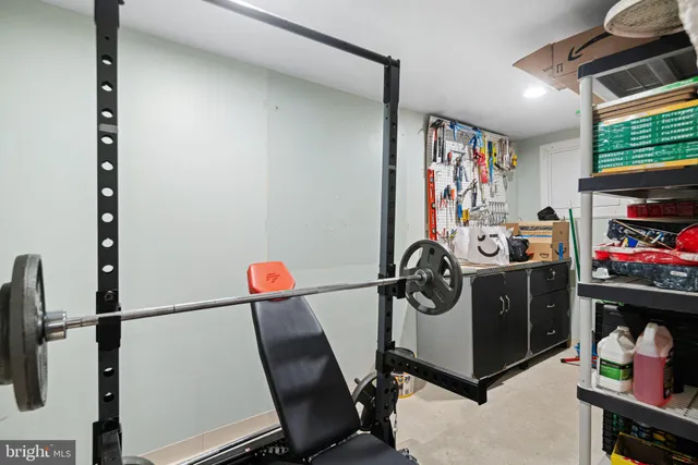 a living room with furniture a flat screen tv and a window