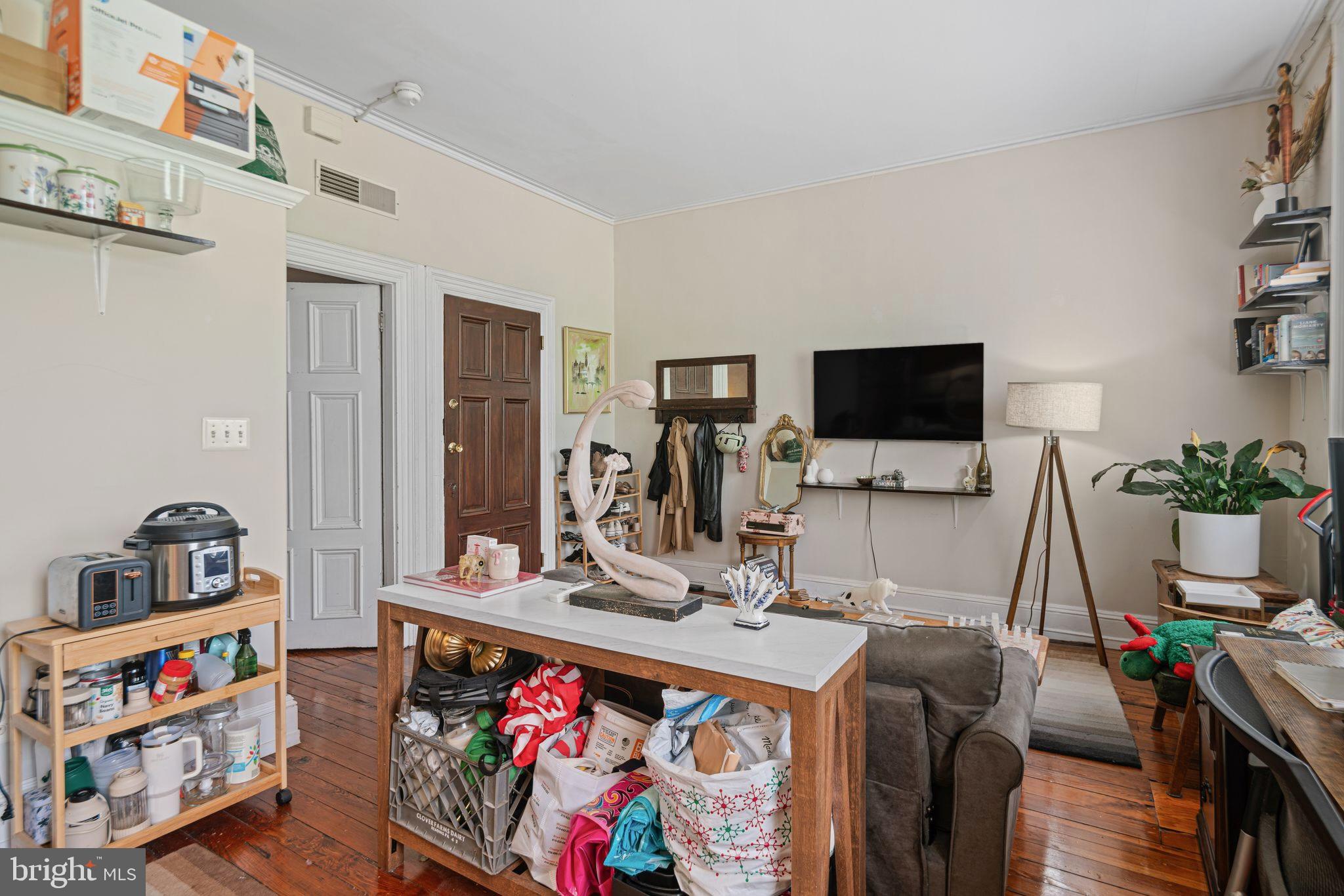 1935 Spring Garden Street Philadelphia, PA 19130 - Photo 35 of 49 a living room with furniture and a flat screen tv