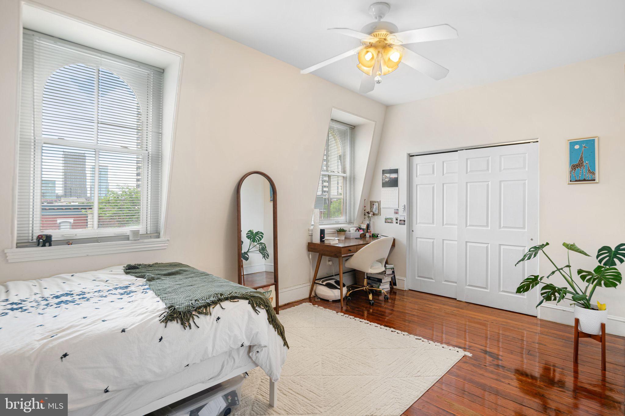 1935 Spring Garden Street Philadelphia, PA 19130 - Photo 45 of 49 a living room with a bed furniture and a window