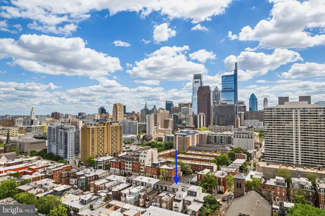 a front view of a building with parking space
