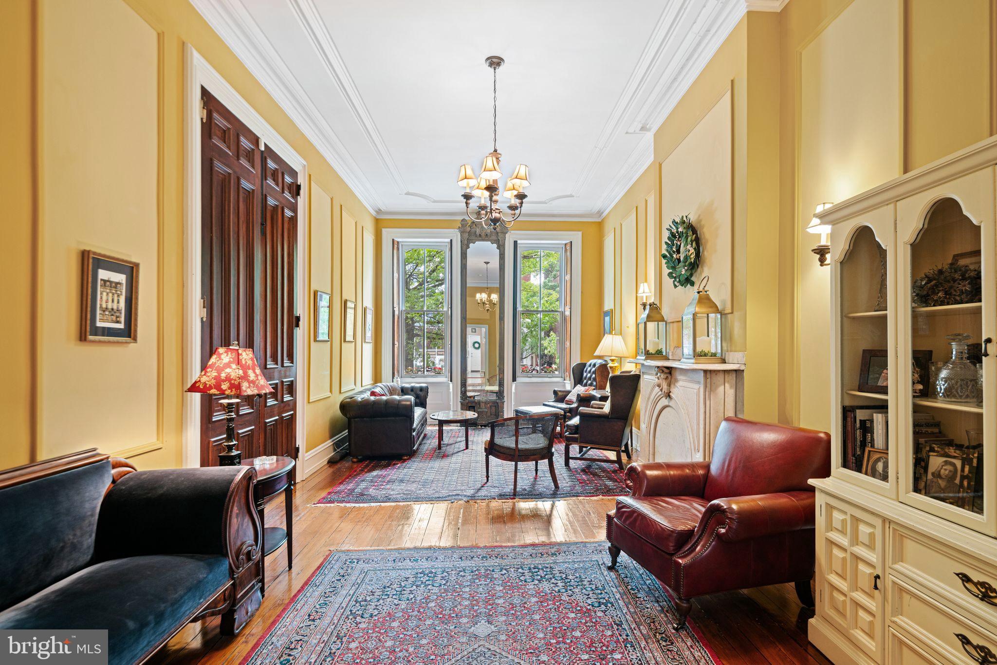 1935 Spring Garden Street Philadelphia, PA 19130 - Photo 6 of 49 a living room with furniture and a chandelier