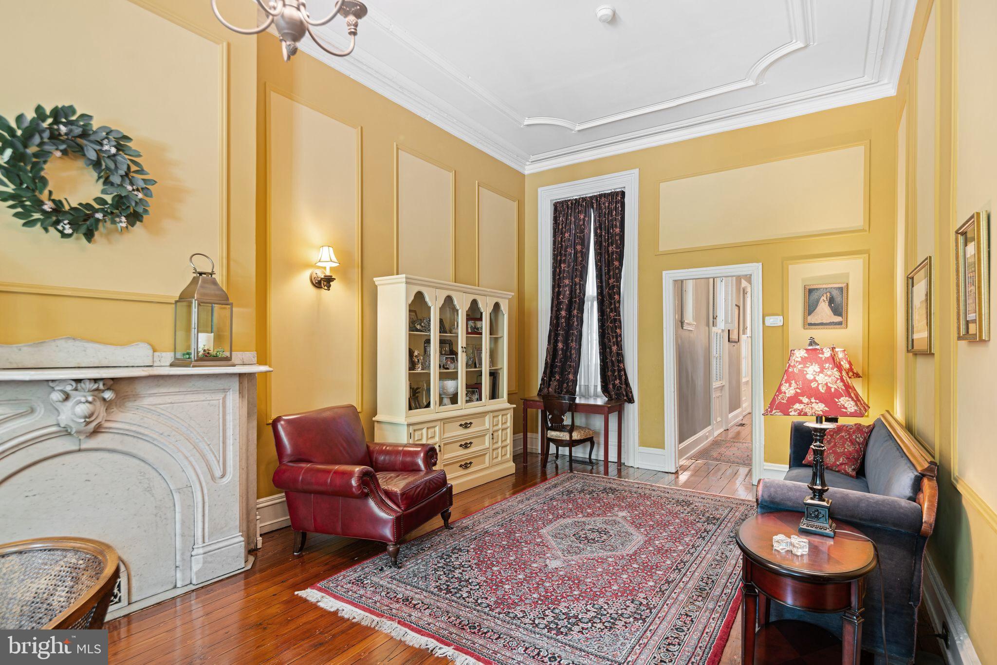 1935 Spring Garden Street Philadelphia, PA 19130 - Photo 8 of 49 a living room with furniture windows and a rug
