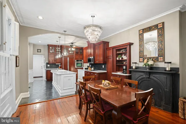 a view of a dining room with furniture large window and wooden floor