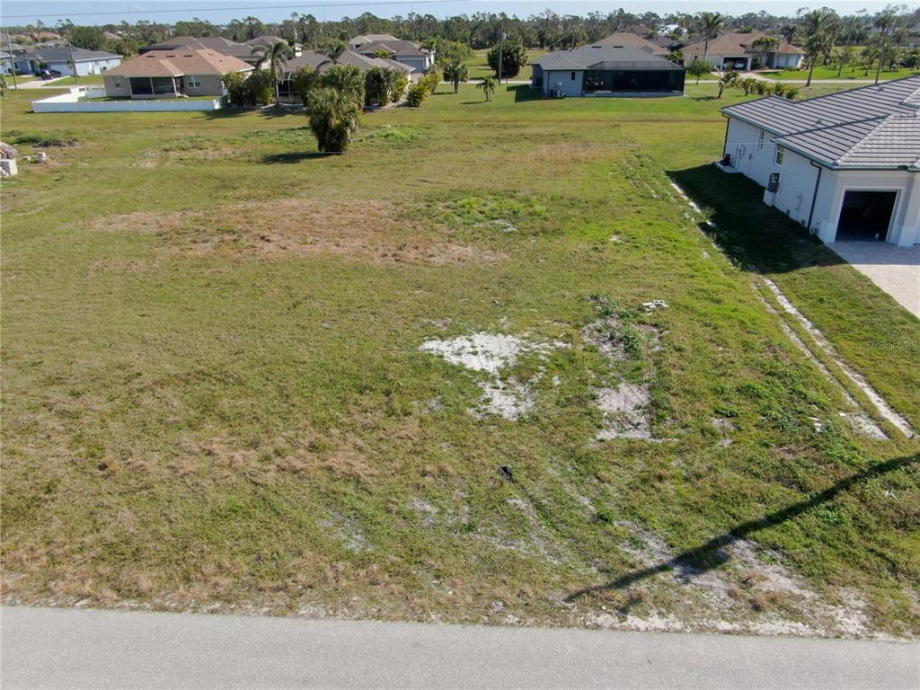 191 Rotonda Boulevard South Rotonda West, FL 33947 - Photo 2 of 8 an aerial view of residential houses with outdoor space