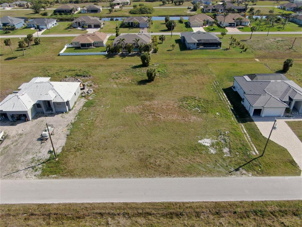 191 Rotonda Boulevard South Rotonda West, FL 33947 - Photo 3 of 8 a view of a yard with an outdoor seating