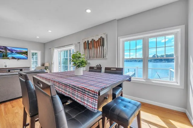 a dining room with a table chairs and a bed
