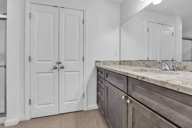 a bedroom with a large bed and a large window