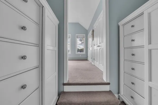 a bathroom with a shower sink vanity and mirror