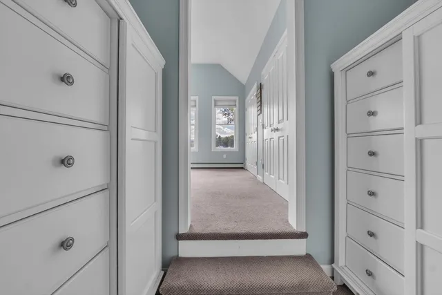 a bathroom with a shower sink vanity and mirror
