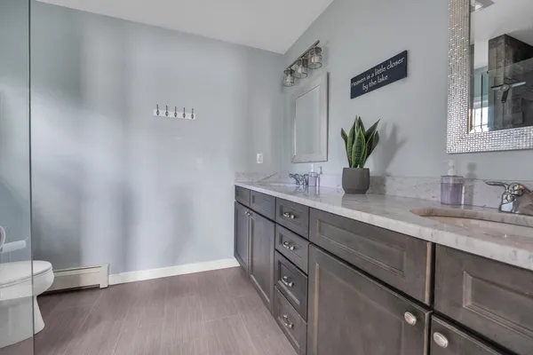 a bedroom with bed and window