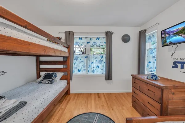 a living room with furniture and chandelier