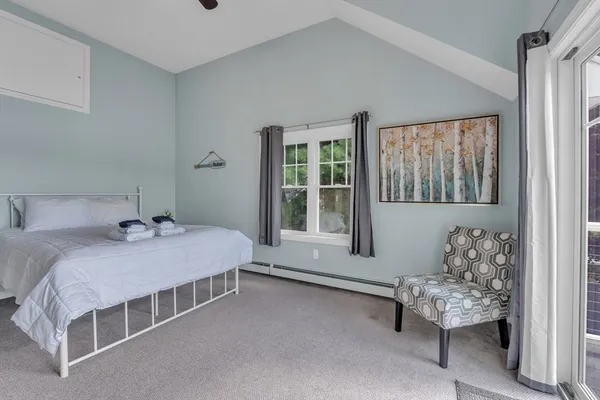 a room with furniture and large windows