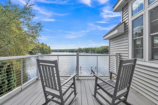 a view of a chairs and table in the balcony