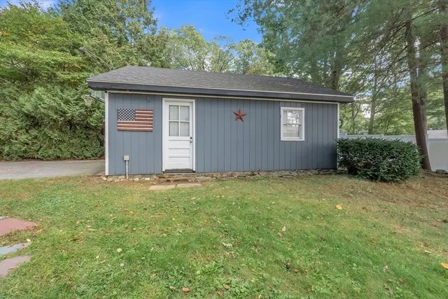 an aerial view of a house with a yard